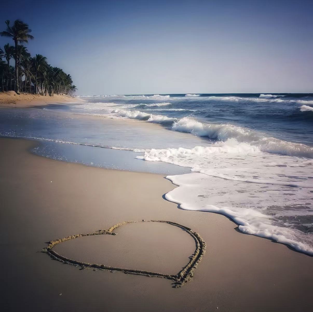 The waves are crashing against the beach.