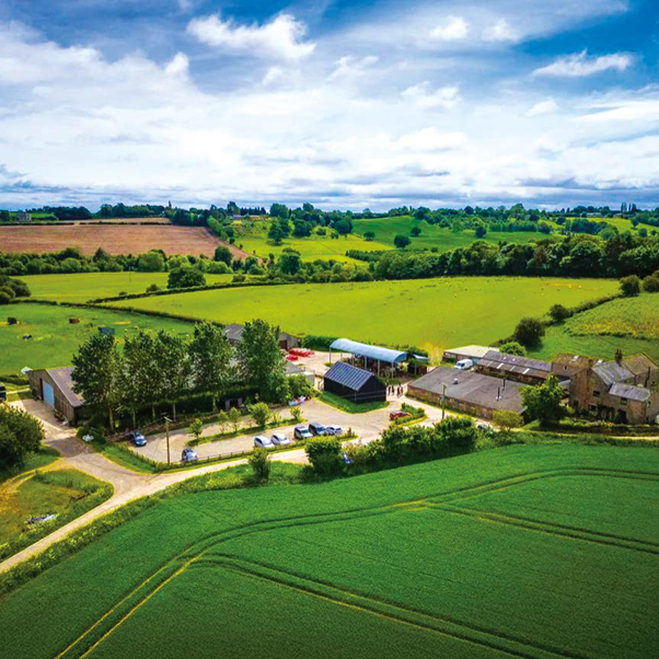 A wide view of the Living Potential farm and surrounding landscape